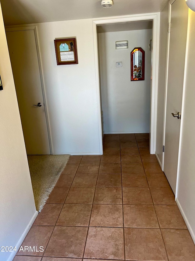 hall featuring tile patterned floors