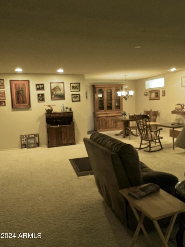carpeted living room featuring a notable chandelier and recessed lighting