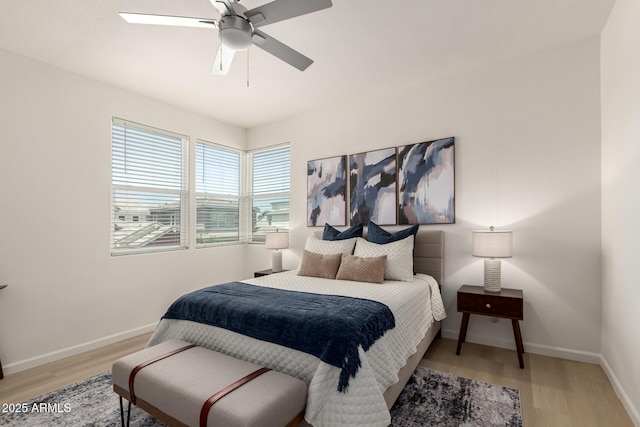 1879 W 23rd Ave, Apache Junction, AZ 85120 - bedroom with wood finished floors, baseboards, and a ceiling fan