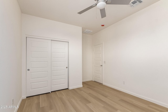 1879 W 23rd Ave, Apache Junction, AZ 85120 - unfurnished bedroom featuring light wood-style flooring, baseboards, a closet, and a ceiling fan
