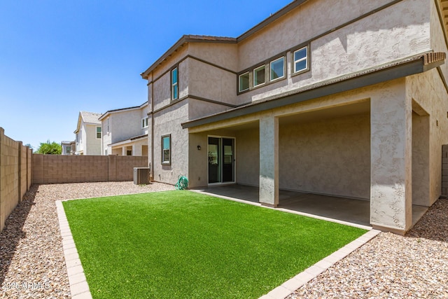 1879 W 23rd Ave, Apache Junction, AZ 85120 - back of house featuring a patio area, cooling unit, and stucco siding