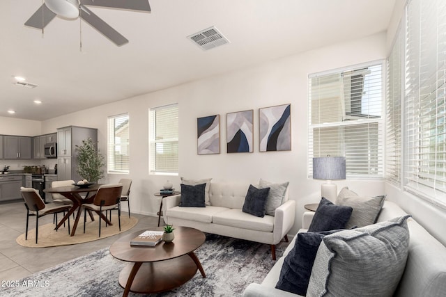 1879 W 23rd Ave, Apache Junction, AZ 85120 - living room featuring light tile patterned floors, ceiling fan, recessed lighting, and baseboards
