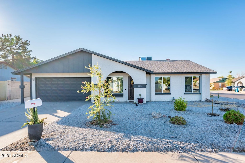 ranch-style home with a garage