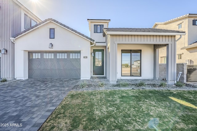 view of front facade with a front yard and a garage