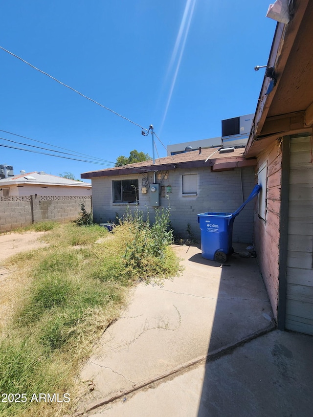 3308 W Missouri Ave, Phoenix, AZ 85017 - rear view of house with brick siding and a patio