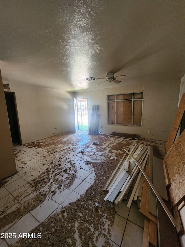 3308 W Missouri Ave, Phoenix, AZ 85017 - unfurnished living room with a ceiling fan and a textured ceiling