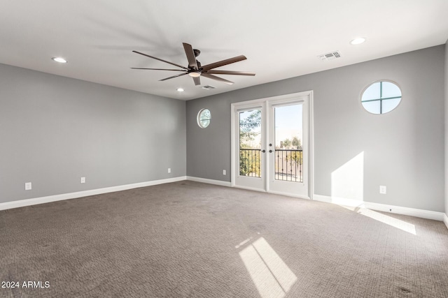 carpeted empty room featuring ceiling fan