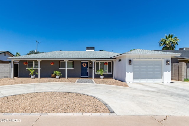 ranch-style home featuring a garage