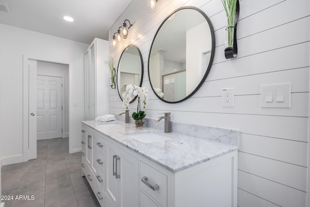 bathroom featuring tile patterned flooring and vanity