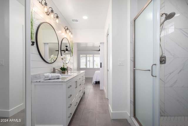 bathroom featuring an enclosed shower, vanity, tile patterned floors, and ceiling fan