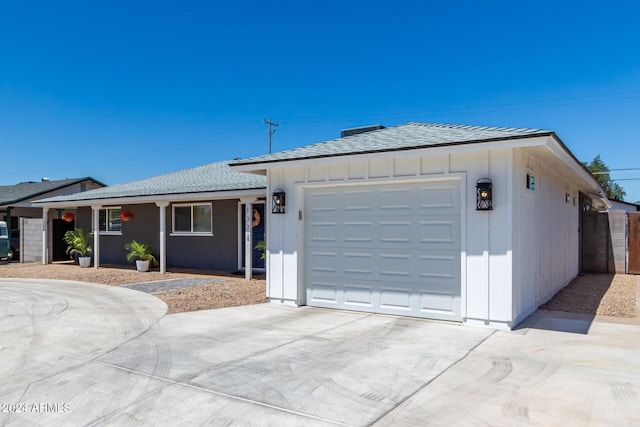 ranch-style home featuring a garage