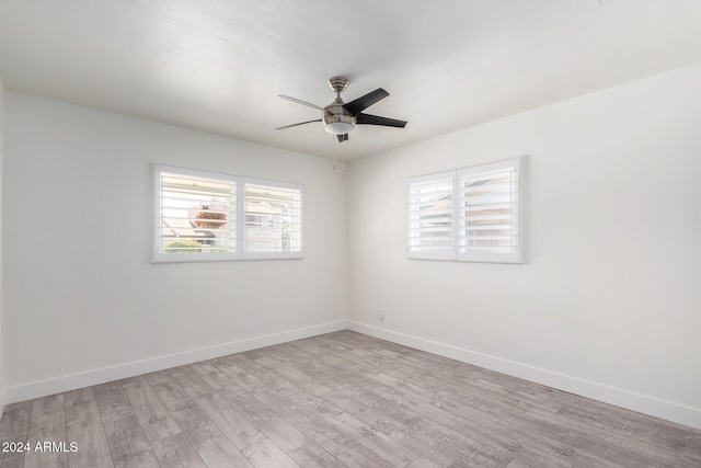 unfurnished room with ceiling fan and light hardwood / wood-style flooring