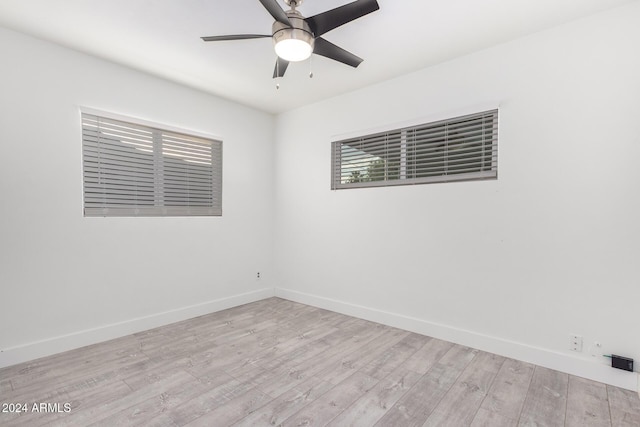 unfurnished room with ceiling fan and light hardwood / wood-style flooring