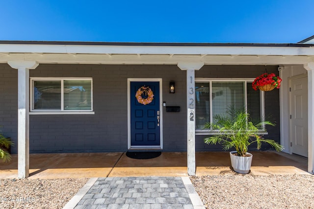 doorway to property featuring a porch