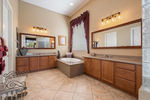full bath with plenty of natural light, a bath, and a sink