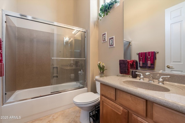 full bath featuring tile patterned flooring, vanity, toilet, and enclosed tub / shower combo