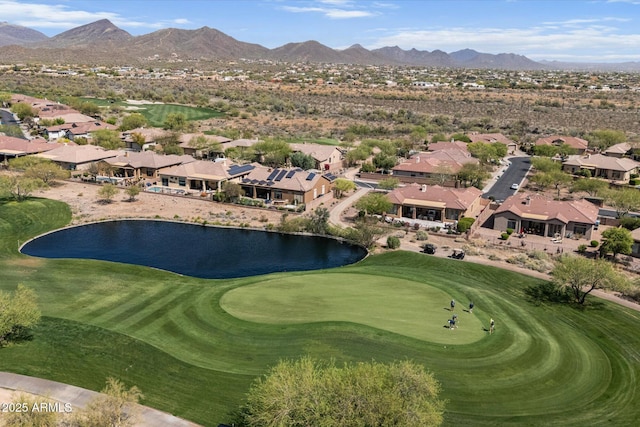 birds eye view of property with golf course view, a water and mountain view, and a residential view