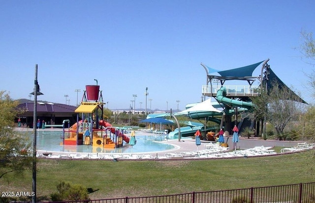 community jungle gym with a yard