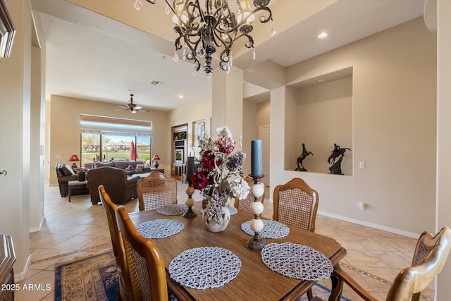 dining area featuring ceiling fan with notable chandelier, light tile patterned floors, baseboards, visible vents, and recessed lighting