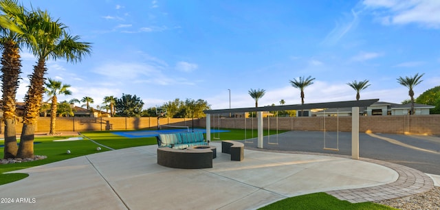 view of patio with a fire pit