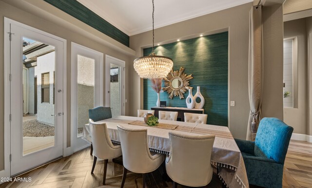 dining room with parquet flooring and a notable chandelier