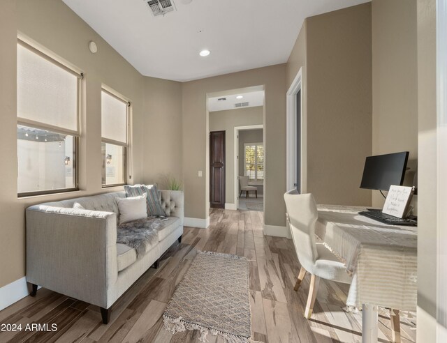 home office with wood-type flooring