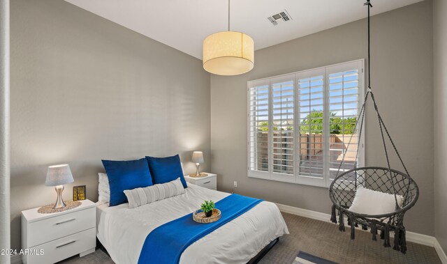 bedroom featuring carpet, visible vents, and baseboards