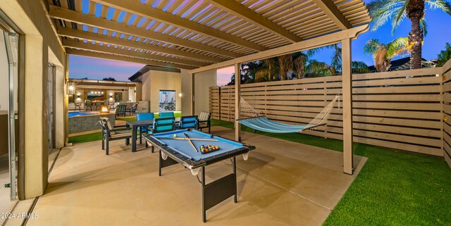 patio terrace at dusk with a pergola