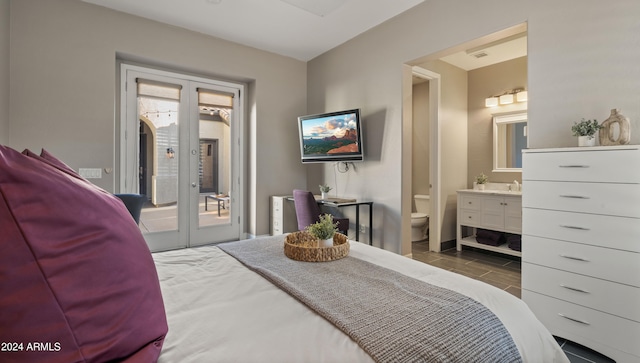 bedroom featuring french doors, ensuite bath, visible vents, and access to exterior