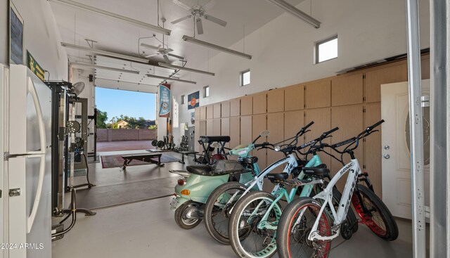 garage with ceiling fan and white fridge