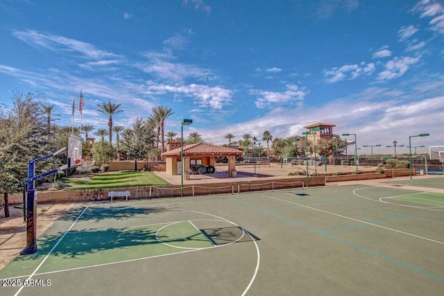 view of basketball court with playground community, community basketball court, a gazebo, and fence