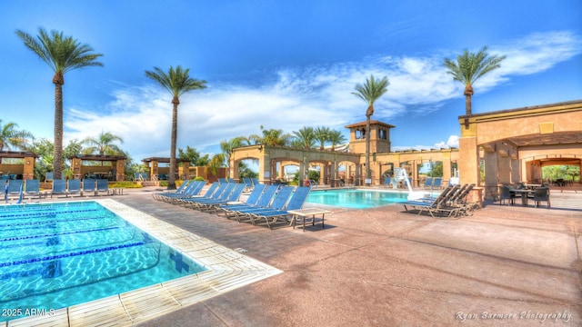 community pool with a patio area