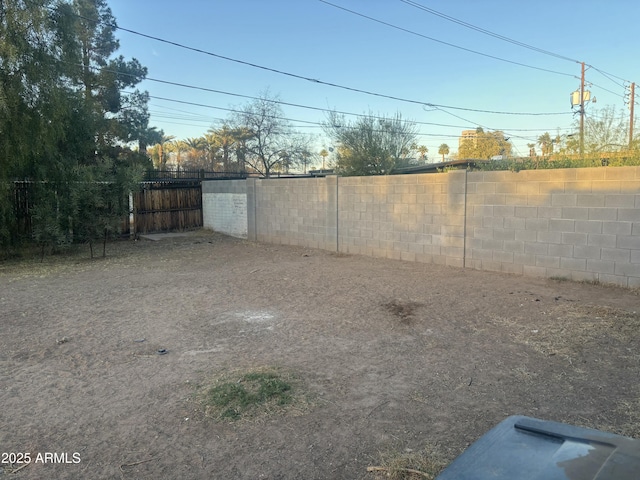 view of yard with a fenced backyard