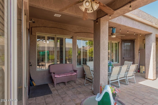 view of patio / terrace featuring ceiling fan