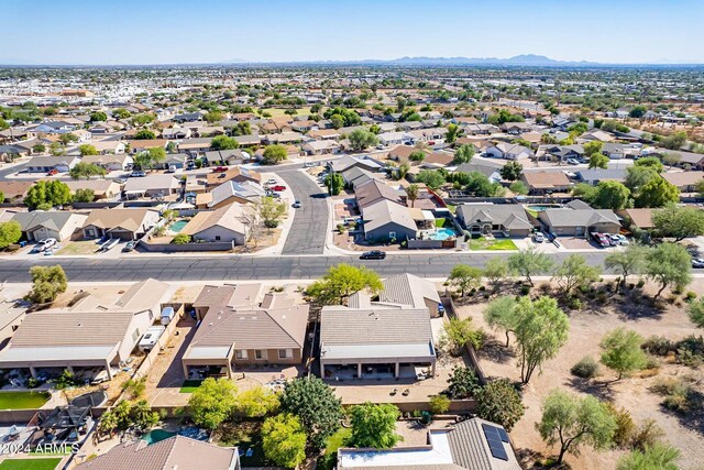 birds eye view of property with a mountain view