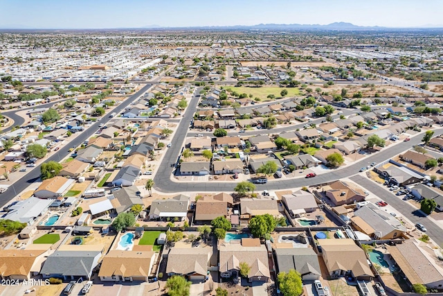 birds eye view of property with a mountain view