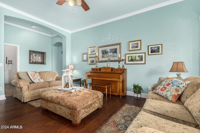 living room with dark hardwood / wood-style flooring, ceiling fan, and ornamental molding