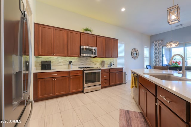 4576 W Agave Ave, Eloy, AZ 85131 - kitchen with visible vents, decorative light fixtures, stainless steel appliances, light countertops, and a sink