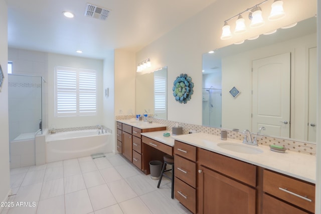 4576 W Agave Ave, Eloy, AZ 85131 - bathroom featuring visible vents, tile patterned flooring, vanity, a shower stall, and a bath