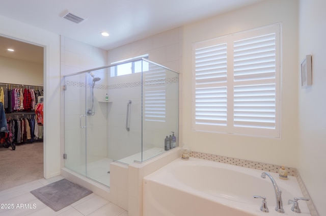 4576 W Agave Ave, Eloy, AZ 85131 - full bath with a stall shower, a spacious closet, visible vents, and a bath