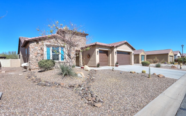 view of front of house with stucco siding, an attached garage, stone siding, driveway, and a tiled roof