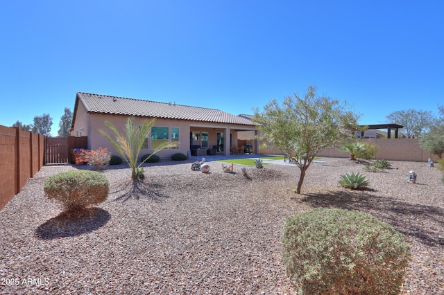 4576 W Agave Ave, Eloy, AZ 85131 - back of house with a fenced backyard, a patio, and stucco siding