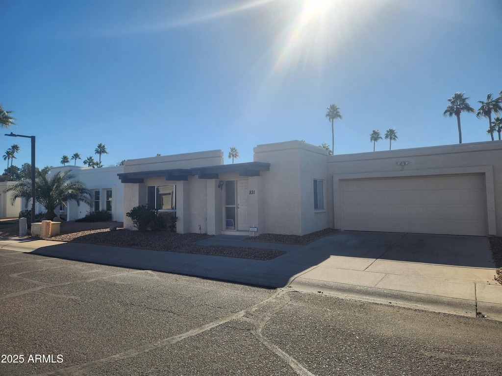 view of front of property with a garage