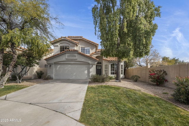 mediterranean / spanish-style home with a garage and a front lawn