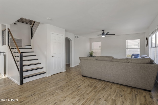 living room featuring ceiling fan and light hardwood / wood-style floors