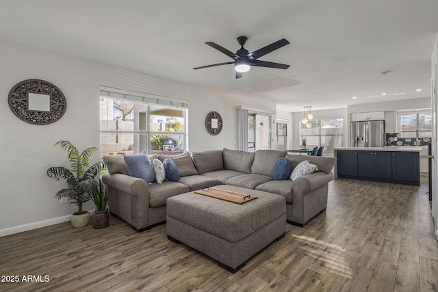 living room with hardwood / wood-style flooring and ceiling fan