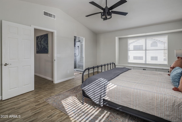 bedroom with wood-type flooring, vaulted ceiling, connected bathroom, and ceiling fan