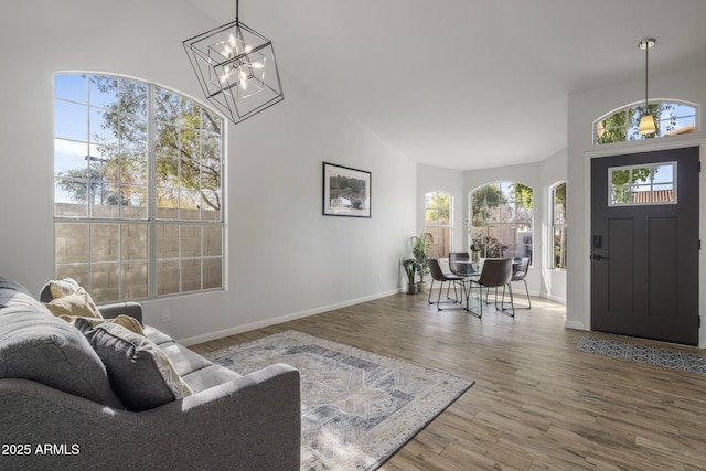 foyer entrance featuring hardwood / wood-style flooring and a chandelier