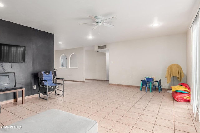 interior space featuring visible vents, a ceiling fan, recessed lighting, light tile patterned flooring, and baseboards