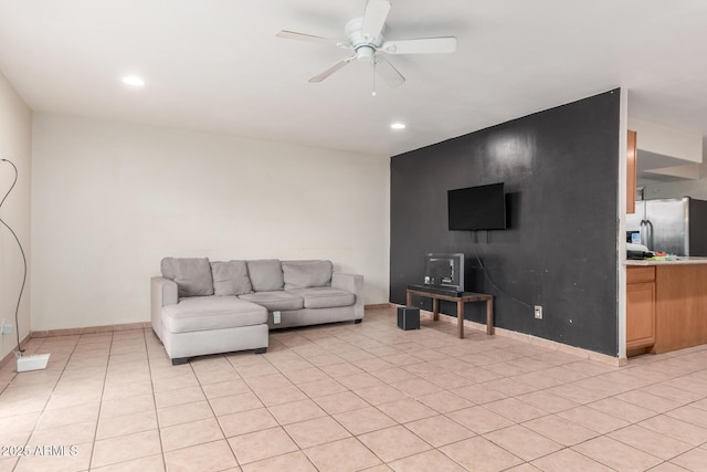 living room with light tile patterned floors, recessed lighting, baseboards, and a ceiling fan